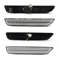 Two black car side mirrors with LED lights on a white background
