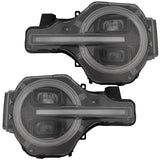 Ford Bronco 21-25 LED Projector Headlights w/ Ultra High Power LED High/Low Beams & White OLED DRL w/ Start-Up Lighting Sequence & Scanning Amber LED Turn Signals - Smoked Lens