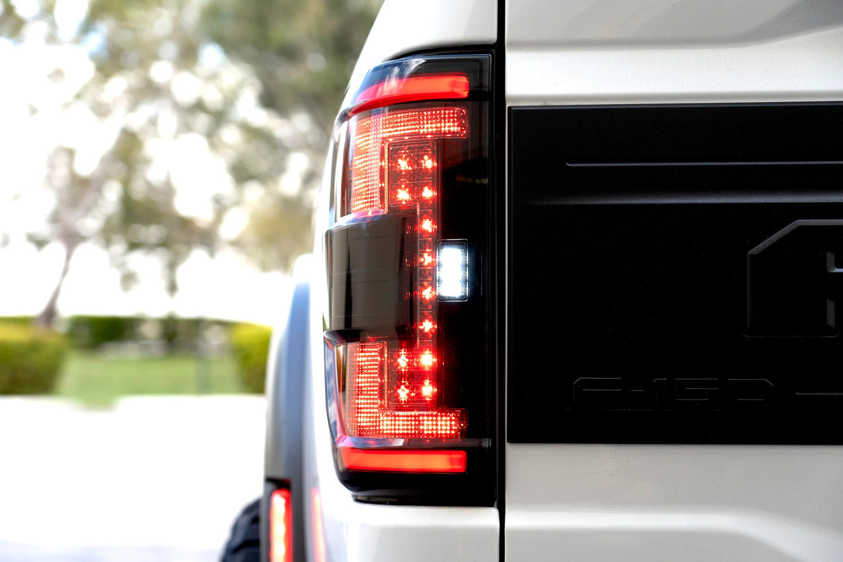 Ford F150 & Ford RAPTOR 21-23 (Attn: This Part ONLY Replaces OEM Factory Installed HALOGEN Style Tail Lights w/ Blind Spot Warning System) Start-Up Light Sequence OLED TAIL LIGHTS - Red Smoked Lens